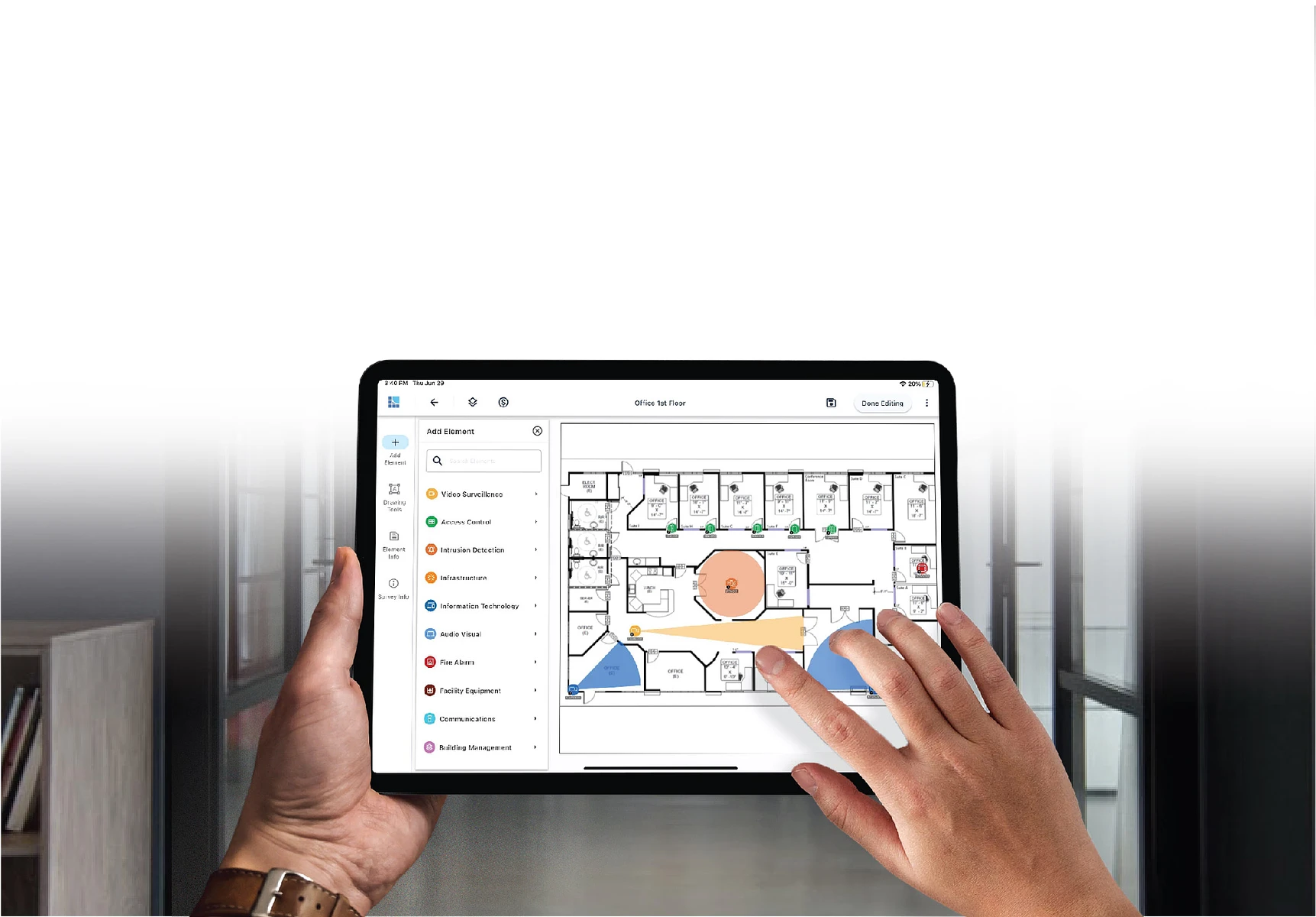 Hands holding tablet with System Surveyor floor plan